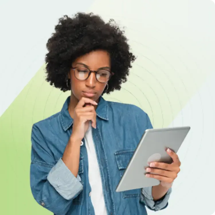 A person with curly hair and glasses, wearing a denim jacket, thoughtfully looks at a tablet. The light green background has subtle arc patterns.